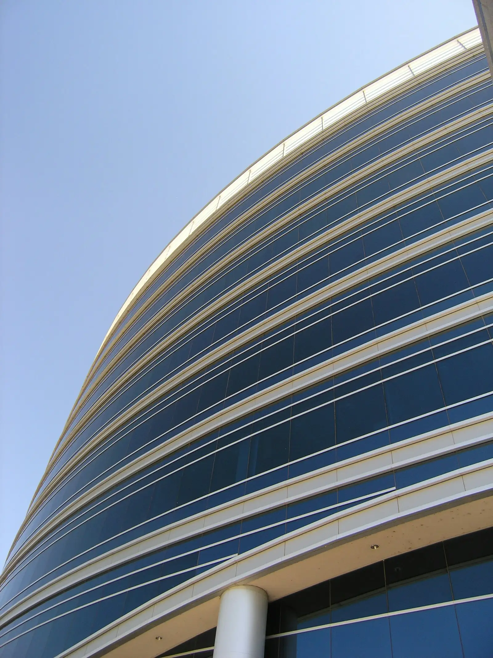 Curved glass facade of a modern office building